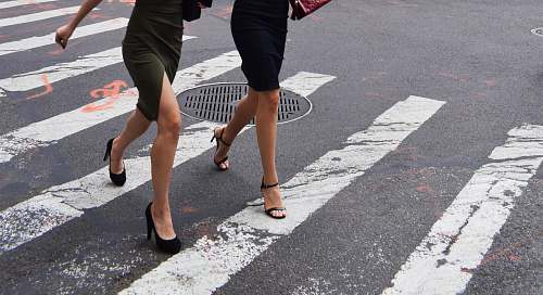 person two women walking on pedestrian lane human