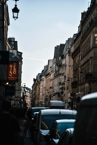 human brown and black concrete buildings automobile