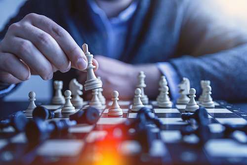 game depth of field photography of man playing chess chess