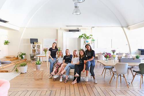 chair group of person sitting indoors furniture
