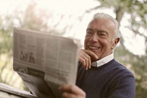 human man reading newspaper newspaper
