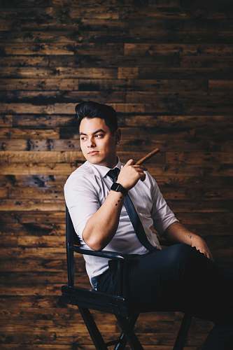 human man sitting down wood