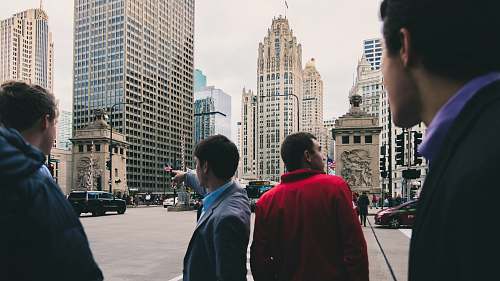 human men standing near road people