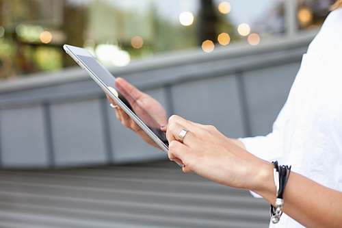 human person holding iPad electronics
