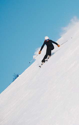 human person skiing on snow with gear set people