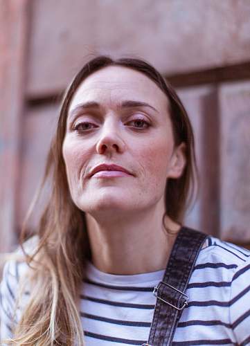human woman in black and white striped shirt face
