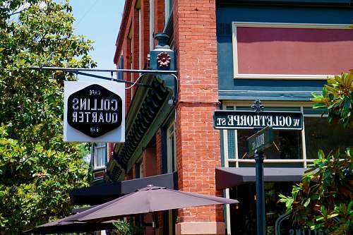 jar Collins Quarter signage during daytime potted plant