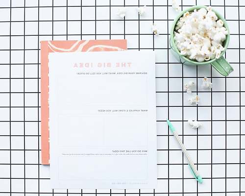 food white printer paper near green ceramic mug vegetable