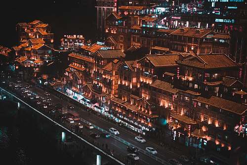 landscape aerial photography of different vehicles on road viewing houses during night time nature