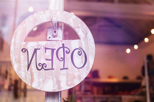 bali selective focus photography of store open sign hanging on door indonesia