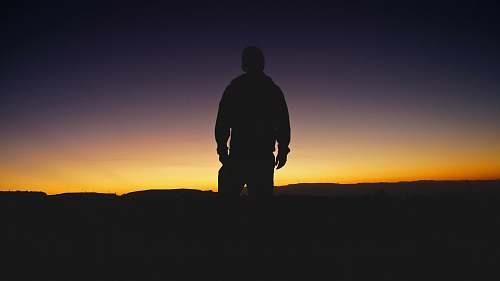 human silhouette of man during sunset people