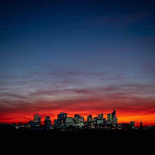 nature high rise buildings sunset
