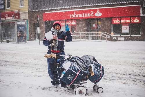 winter person standing beside stroller storm
