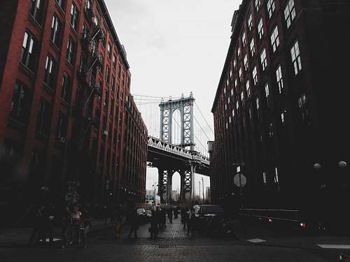 building gray bridge near buildings urban