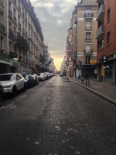 city road street between two buildings road