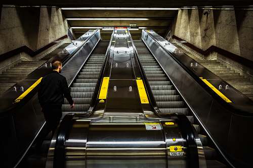 terminal man riding on escalator train