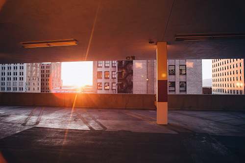 parking two white wall paint buildings during golden hour parking garage