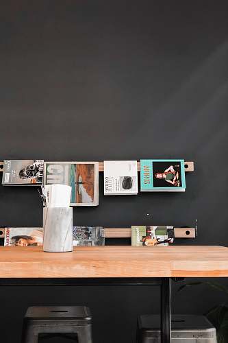 furniture books and magazines hanged over wooden table tabletop