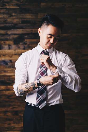accessories man holding his sleeve and necktie accessory