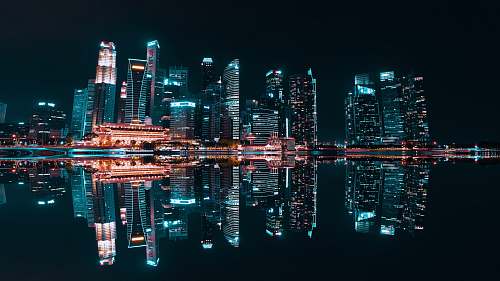 building lighted buildings during night time high rise