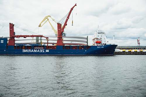 vehicle blue and red Zeamarine ship during daytime boat