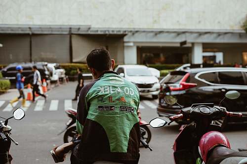 motorcycle man sitting on motorcycle vehicle