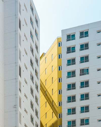 building white and yellow buildings city