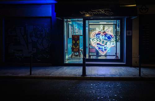 spain landscape photography of neon tattoo sign during nighttime night