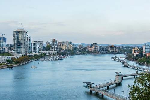 waterfront aerial photography of urban cityscape during daytime dock