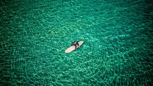 ocean woman surfing on body of water sea