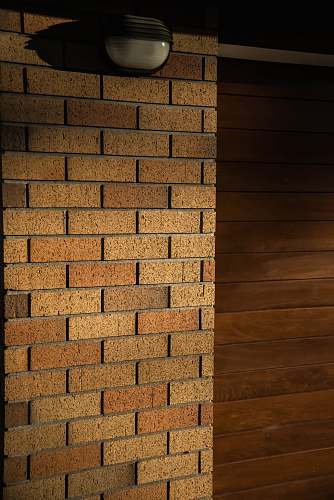 hardwood light bulb on wall brick