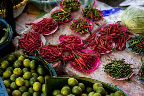  green and red jalapenos on plates 