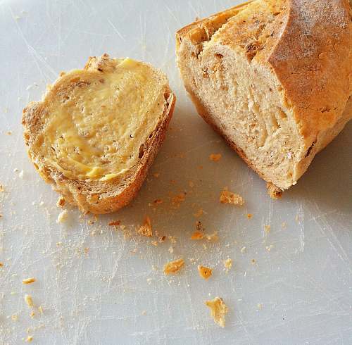 food baked bread with yellow cream close-up photography bun