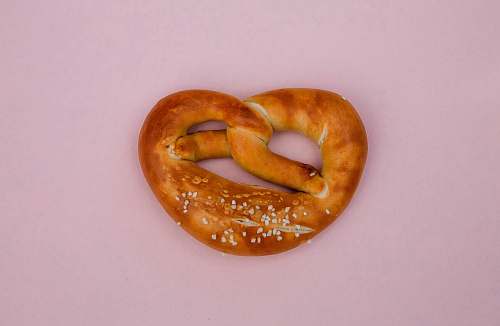 food bread knot on pink surface cracker