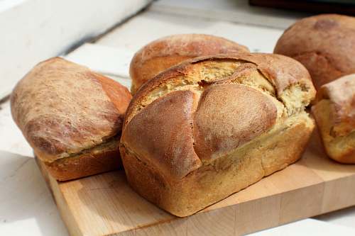 food bread on brown wooden tray loaf
