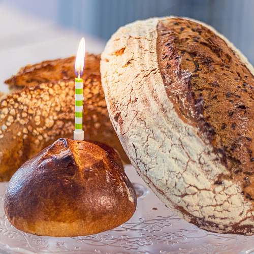 food lighted candle on bread candle