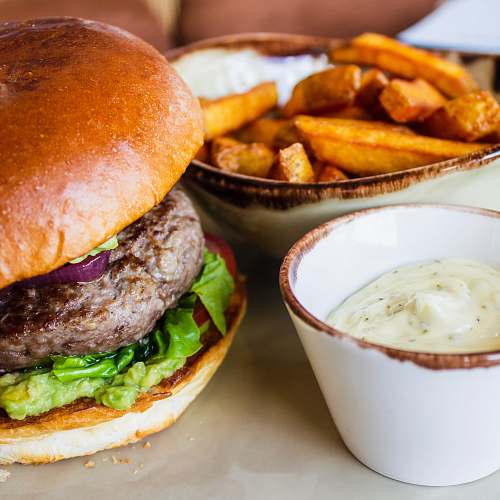 food burger with green leafy vegetable and fries fries