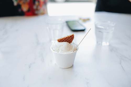creme ice cream in white plastic cup dessert