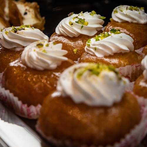 cream baked cupcakes with white icings creme
