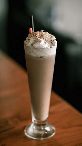creme milkshake topped with whipped cream cream