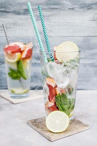 cocktail two filled drinking glasses with beverages alcohol