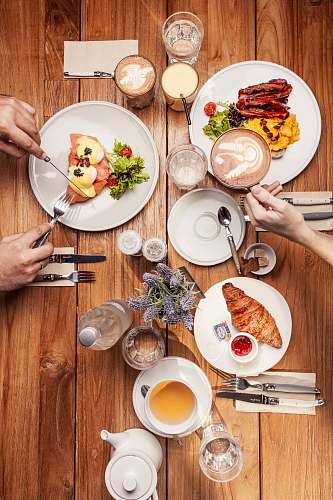 human assorted foods on plate with coffee and utensils person