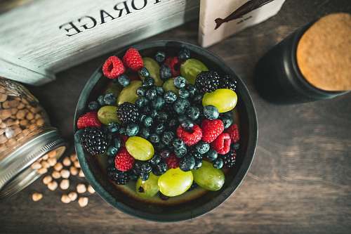 blueberry assorted fruits on gray metal bowl fruit