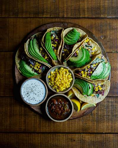 flora assorted tacos on wooden plate corn