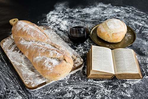 bread baked bread beside book book