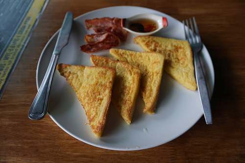 cutlery baked bread on plate fork