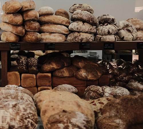 bread baked breads on brown wooden rack bun