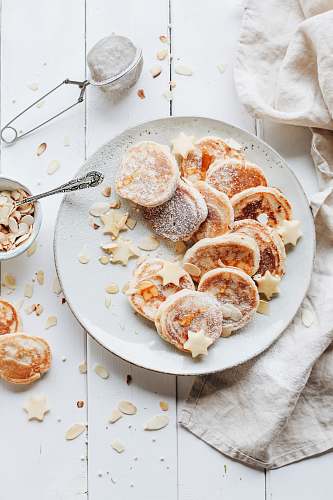 dessert biscuits on plate beside towel pastry