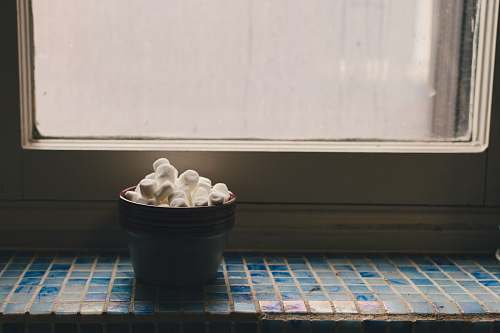 dumpling black container near window pasta