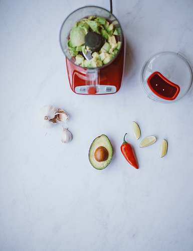 vegetable blender filled with avocado pepper